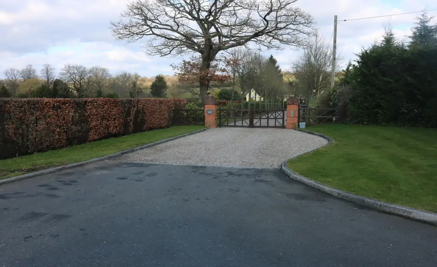 Finished block paved driveway at the front of a brick house, illustrating the kind of work quoted for across Upminster and Hornchurch
